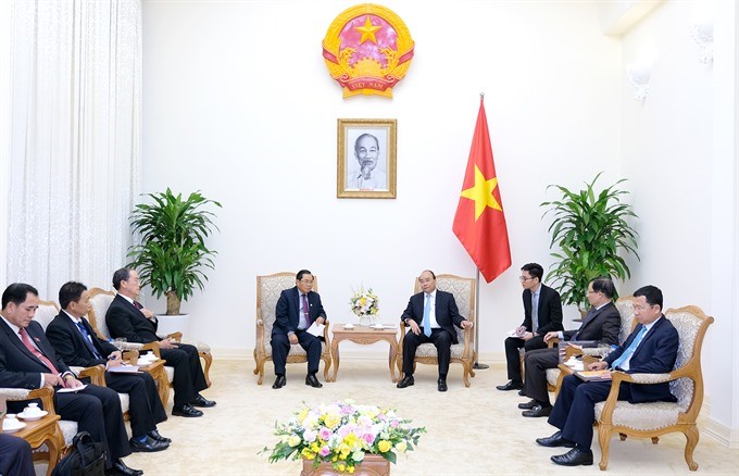 PM looks to maintain high-level visits between Việt Nam, Laos