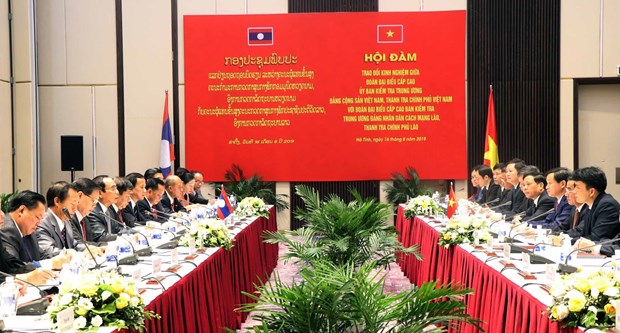 Vietnamese, Lao parties share inspection experience